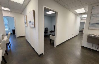 Hallway with private rooms inside Dunwoody Dental Health dental office