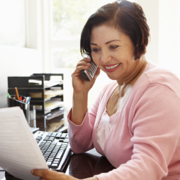 Senior Hispanic woman receptionist at Dunwoody Dental Health