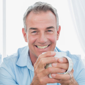 Smiling middle aged men Dunwoody Dental Health patient group