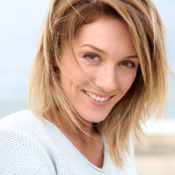 Mature blonde woman smiling Dunwoody Dental Health patient
